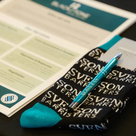 Svenson Barristers branded socks, pen and printed handbook